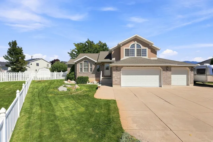Multi-car driveway with a three-car garage