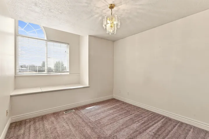 Arched window with integrated seating bench and storage
