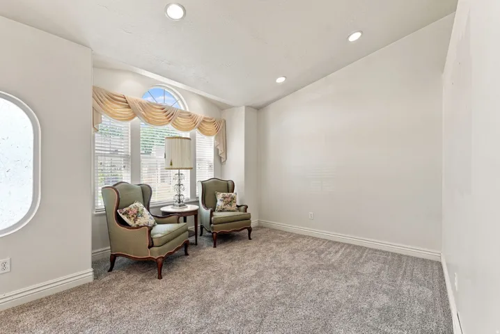 Vaulted ceiling featuring recessed lighting