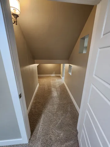 Angled ceiling with a wall-mounted light fixture