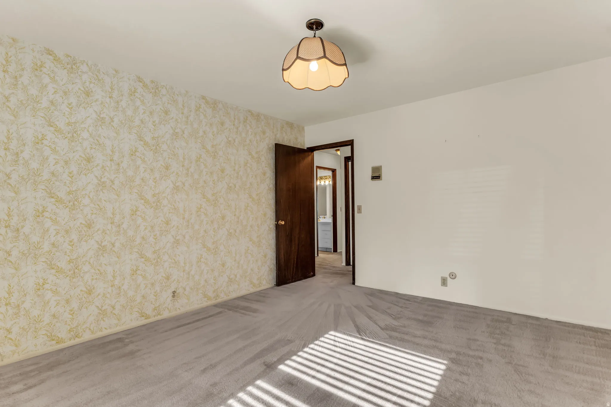 Neutral wall finishes with a textured accent wall