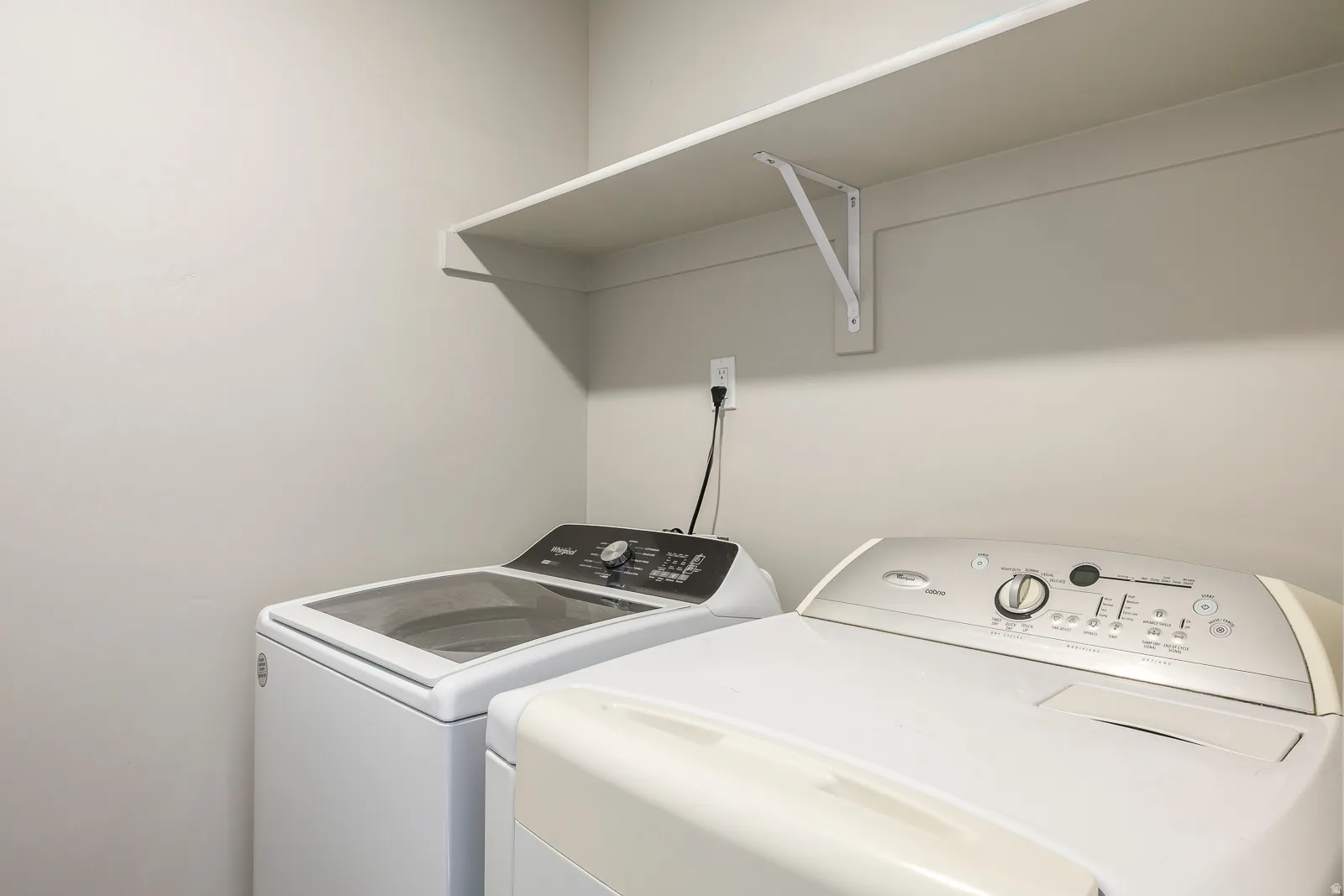 Built-in shelving unit with white support brackets
