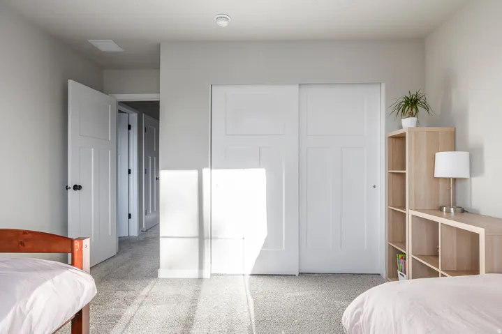 Plush carpet flooring with white walls and white trim