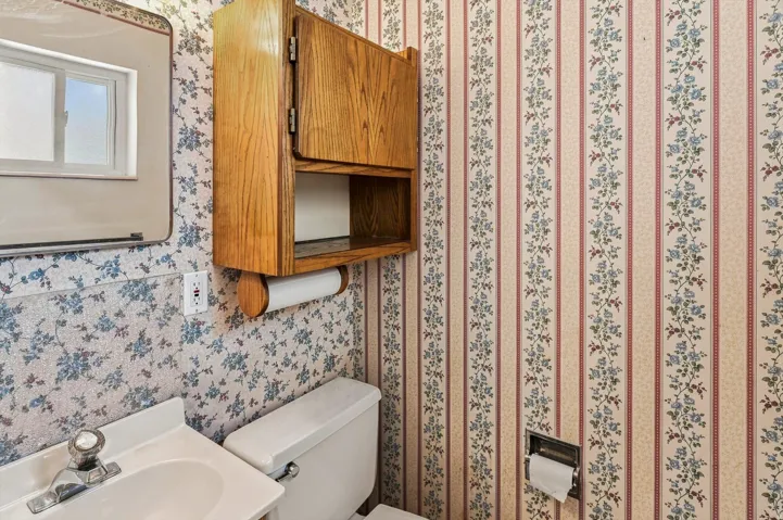 Wall-mounted vanity with an integrated sink and chrome faucet