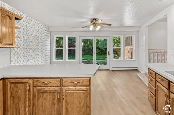 Wood-finish cabinetry with light countertops