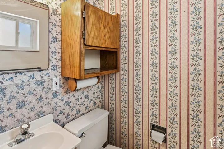 Wall-mounted vanity with an integrated sink and chrome faucet