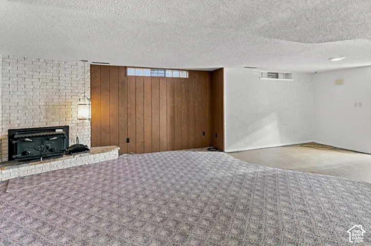White brick fireplace with an attached wood-burning insert