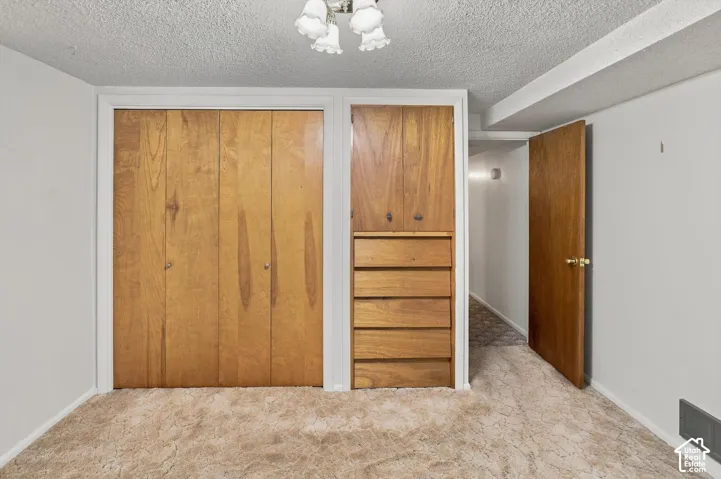 Built-in storage solutions with wood-finish cabinetry and drawers
