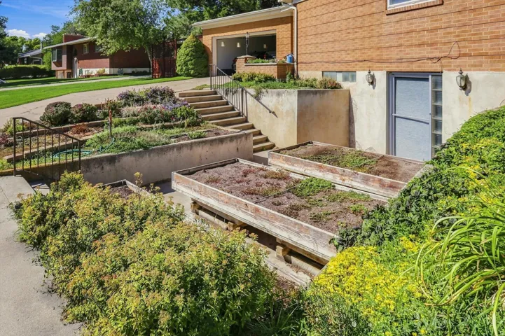 Brick exterior with a basement entrance and glass block window