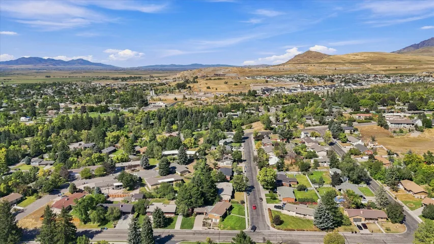 Expansive residential area featuring established homes, mature trees, and paved streets