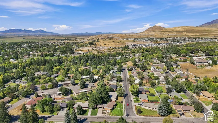 Expansive residential area featuring established homes, mature trees, and paved streets