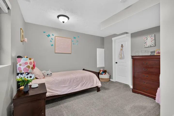Carpeted flooring, gray painted walls, and white trim