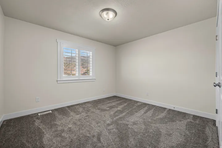 Wall-to-wall carpeting and neutral wall tones