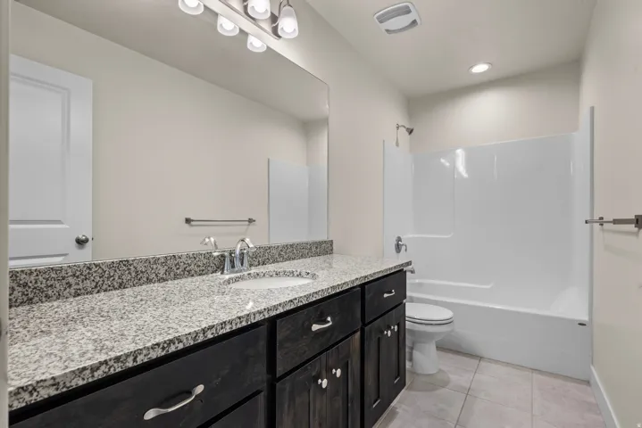 Granite-finish countertop with an integrated sink and chrome faucet