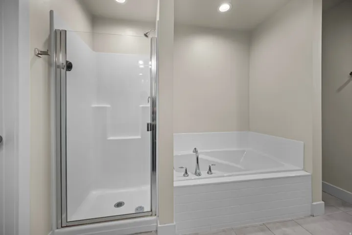 Walk-in shower with clear glass enclosure