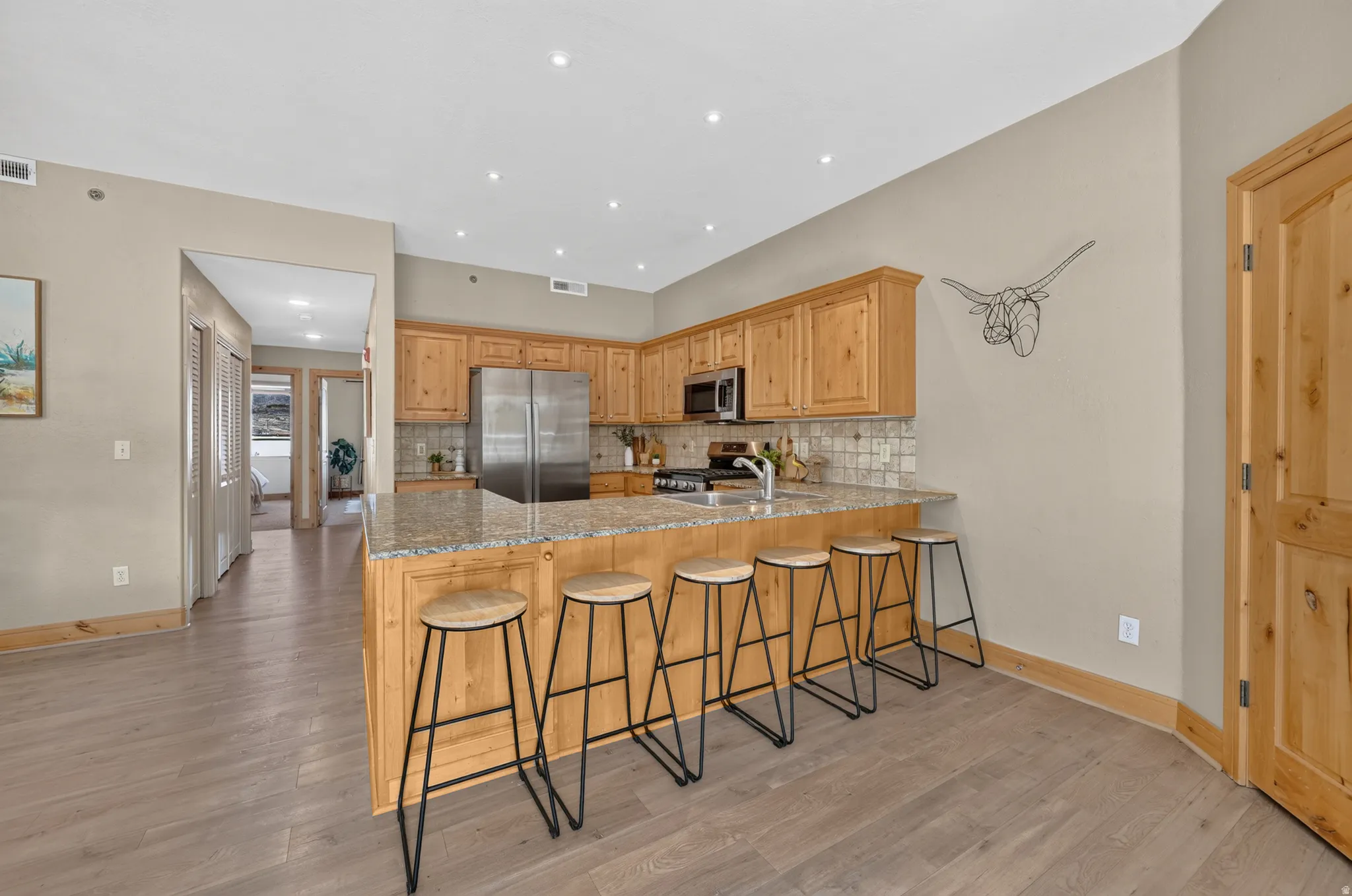 Large kitchen with knotty pine cabinets