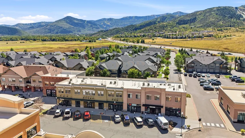 Mixed-use development featuring commercial storefronts and residential structures