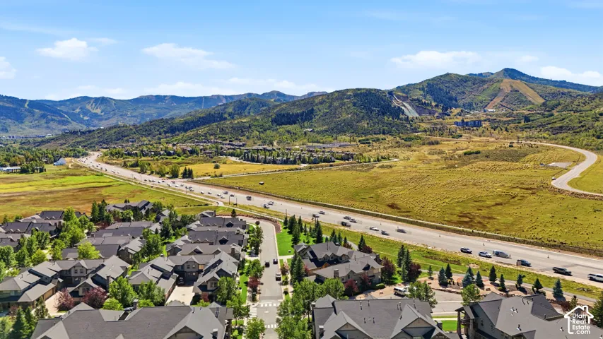 Expansive mountain scenery with established residential development and highway access