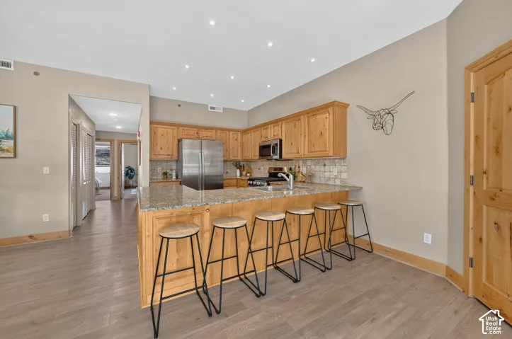 Large kitchen with knotty pine cabinets