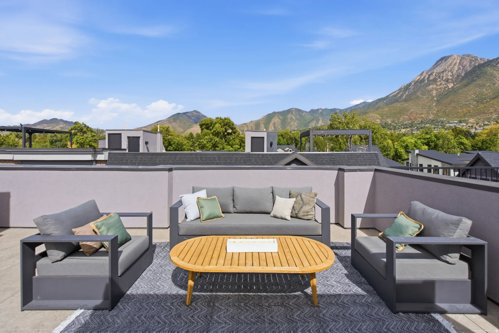 Rooftop terrace with low perimeter walls and a hard-surface floor
