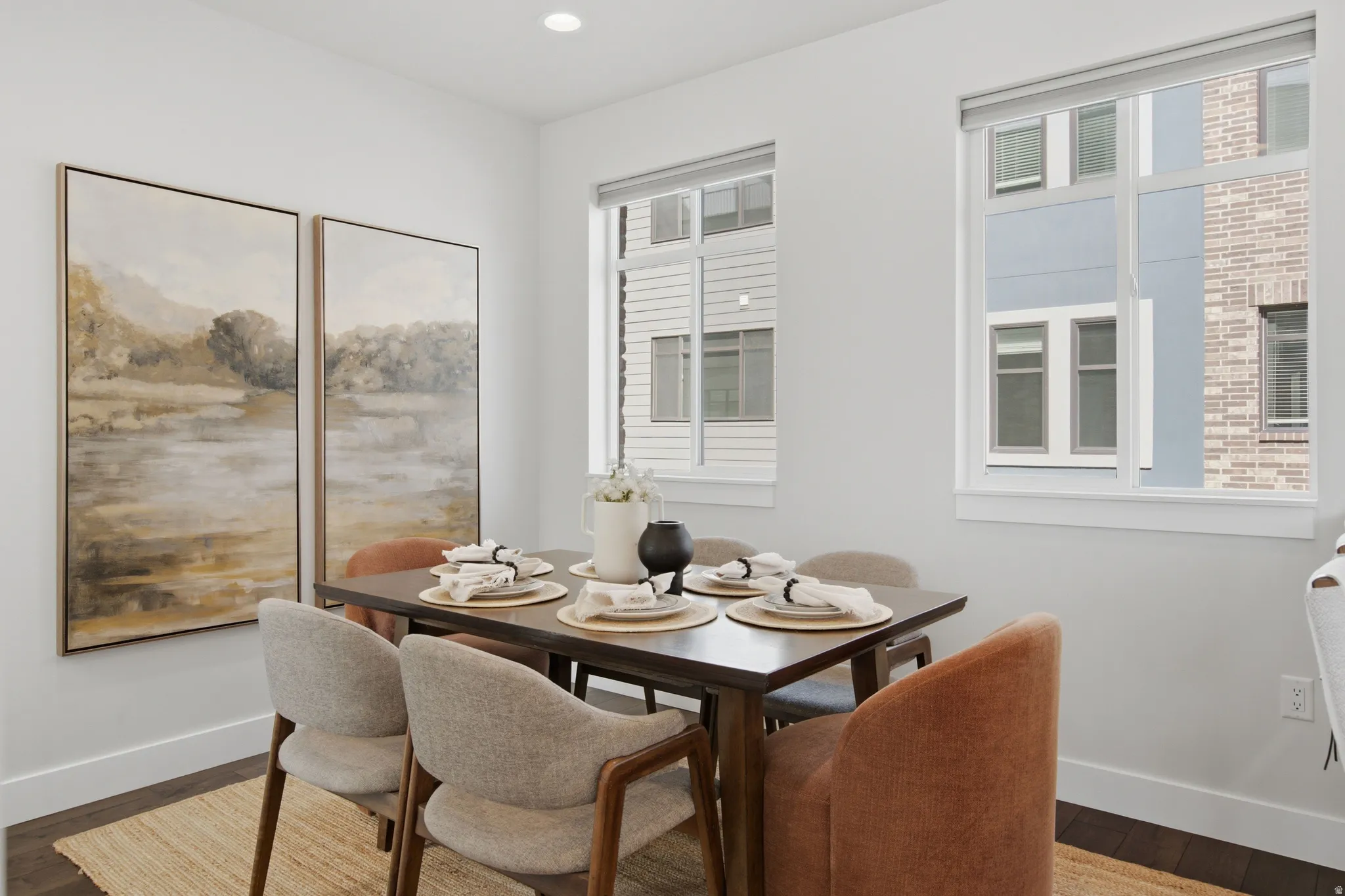 Recessed ceiling lighting with dark wood-finish flooring