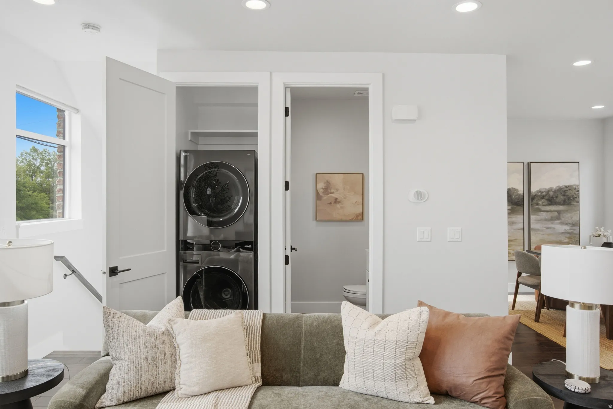 Integrated stacked washer and dryer within a dedicated closet