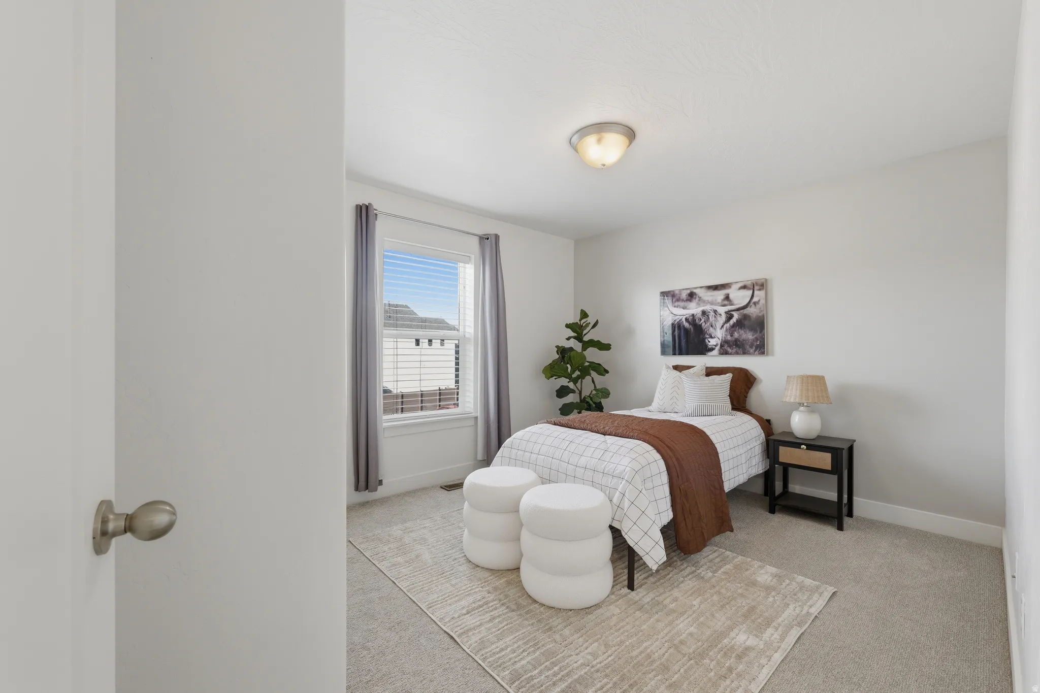 Carpeted flooring, recessed window, ceiling-mounted light fixture, neutral wall color, and a built-in closet