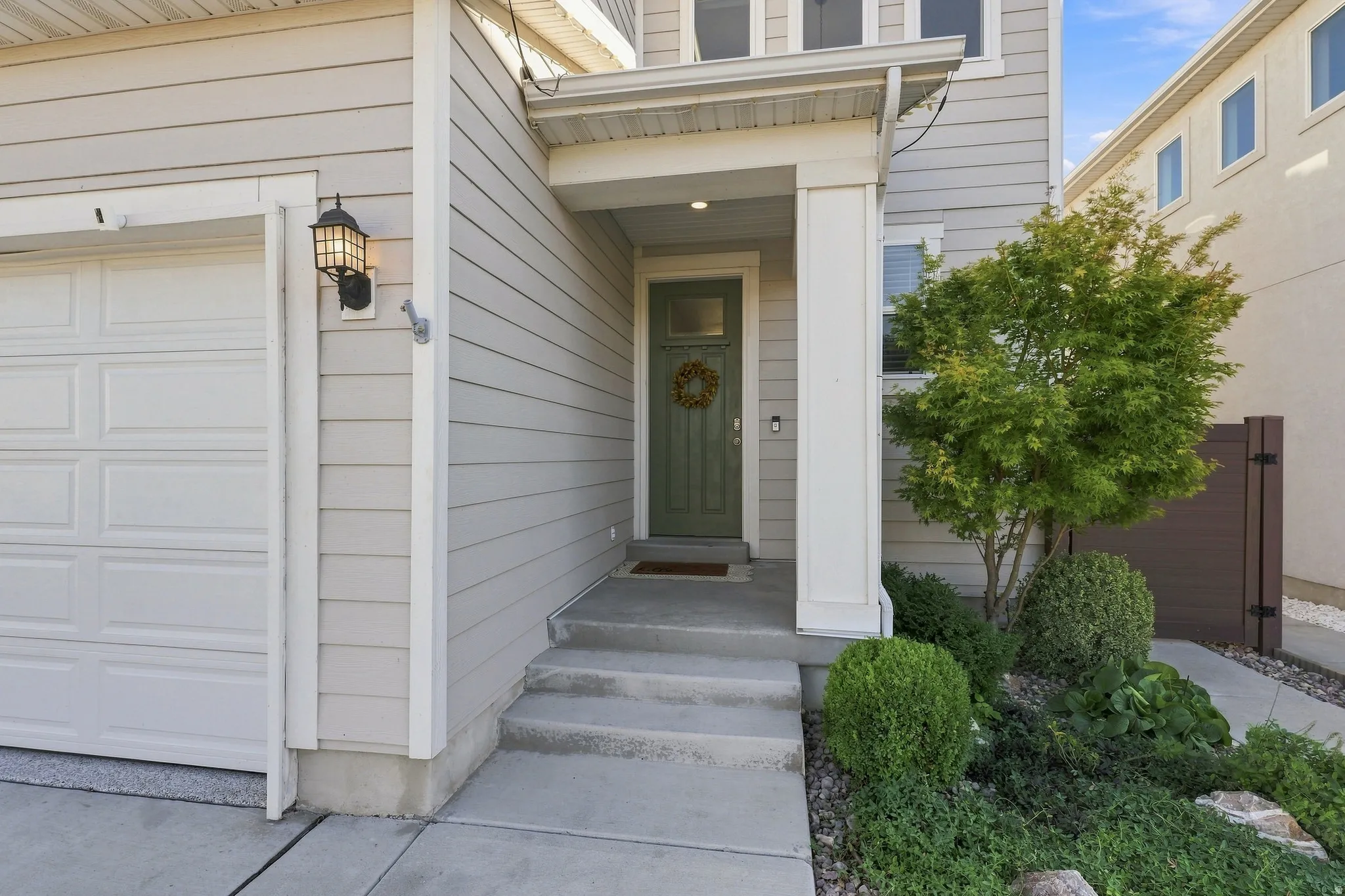Light gray horizontal siding with white trim