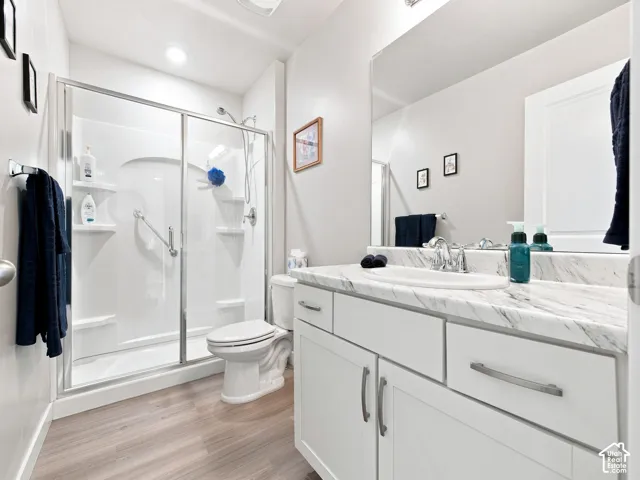 White vanity with a single sink, chrome faucet, and integrated countertop