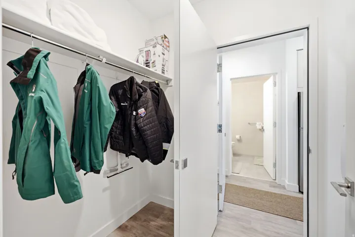 Recessed closet with a hanging rod and upper shelf