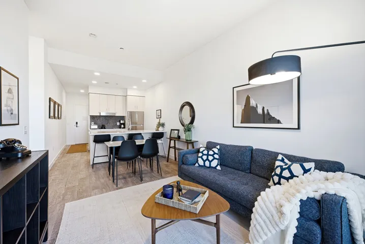 Open-concept living area with wood-finish flooring