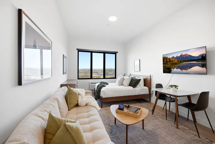 Expansive windows, recessed lighting, and wood-finish flooring