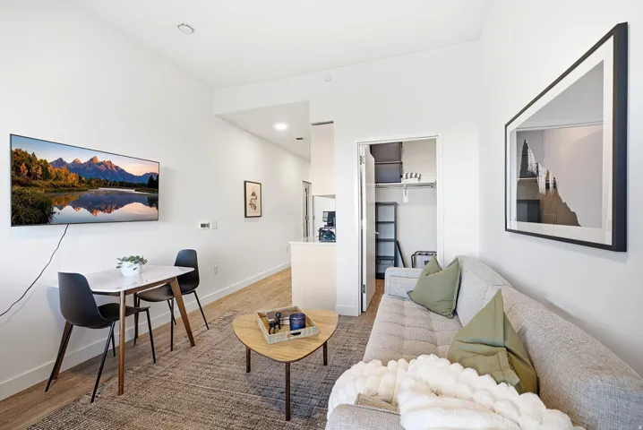 Hardwood-finish flooring, recessed lighting, and a built-in wall niche with shelving