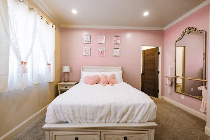 Recessed lighting, wood-finish interior door, and crown molding