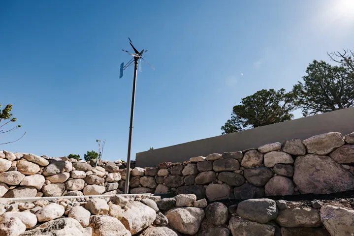 Stone retaining walls with a wind turbine