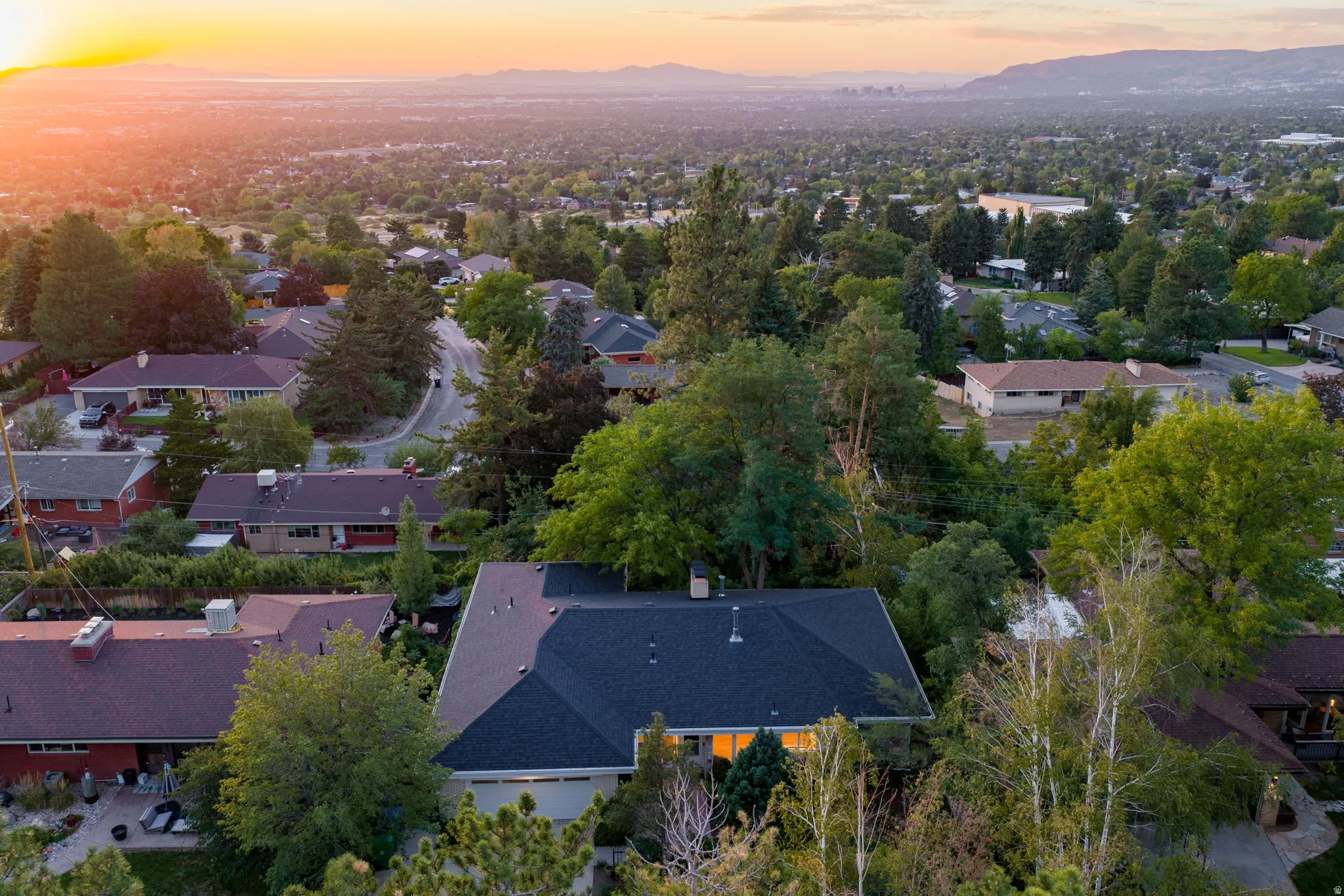 Ariel view of home and Salt Lake City backdrop