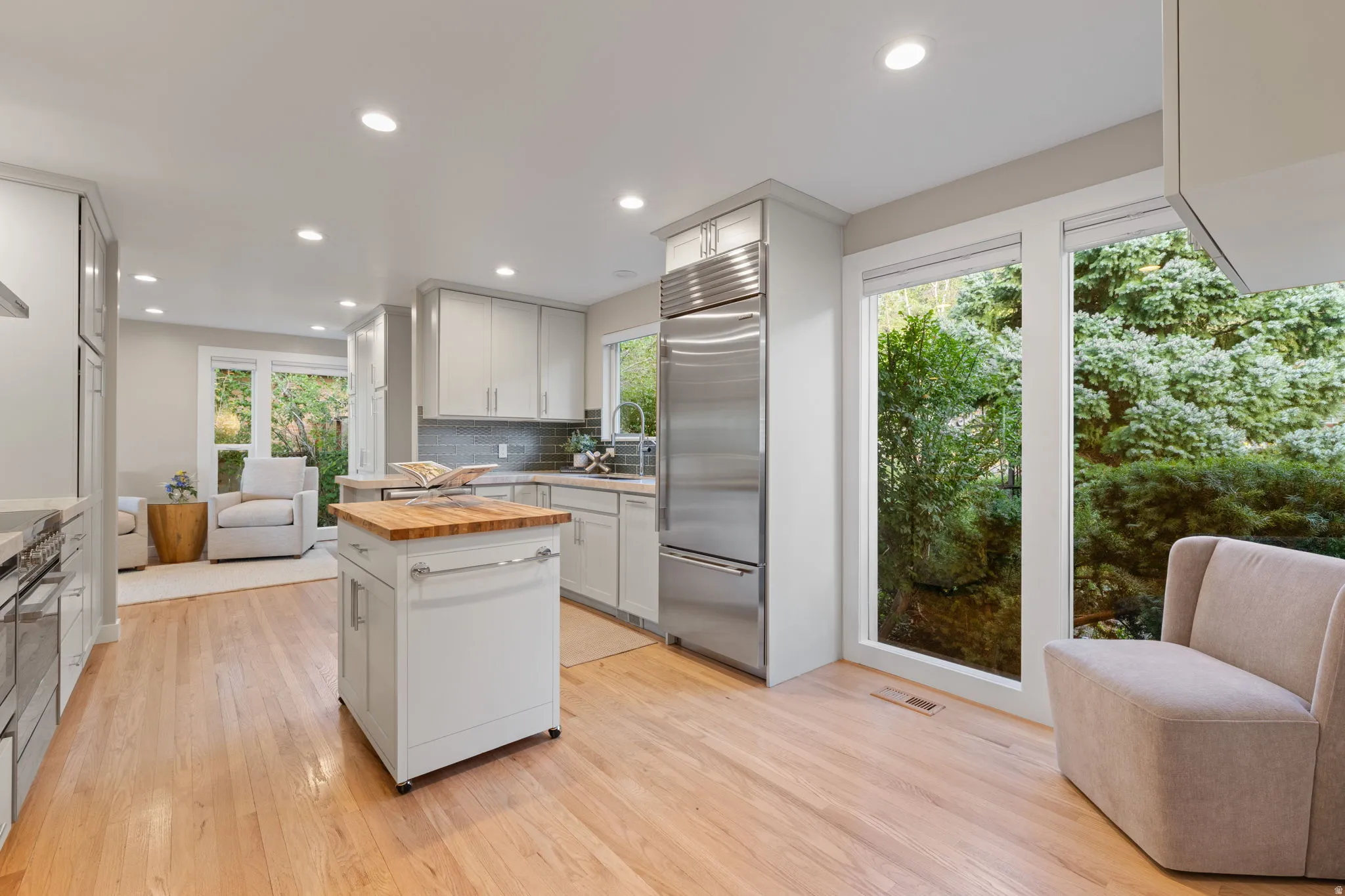 Contemporary kitchen featuring Sub-Zero built-in refrigerator (2018-19 remodel), Miele dishwasher (2025), Fisher + Paykel induction range (2025)