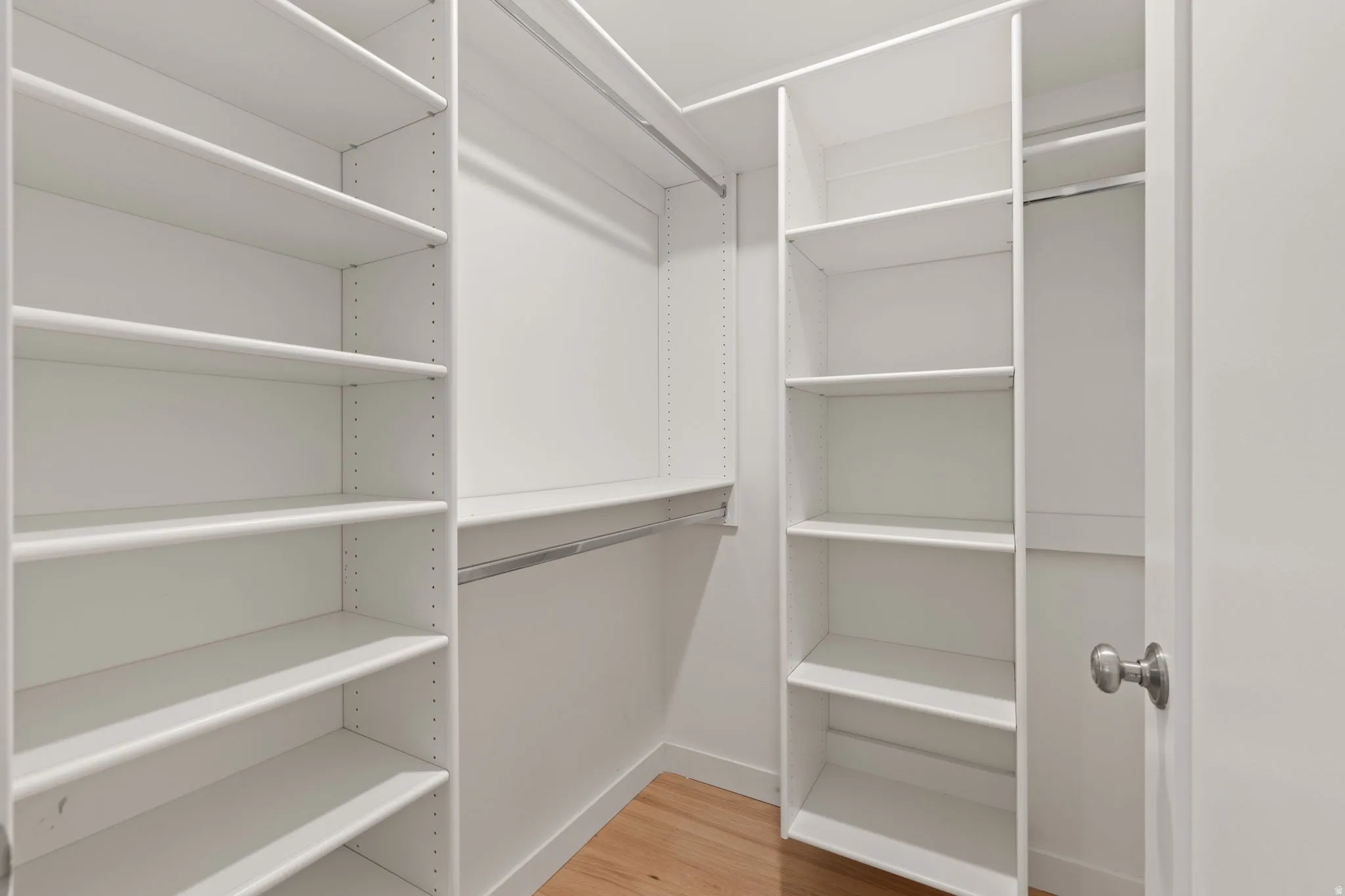 Walk in closet in lower level bedroom