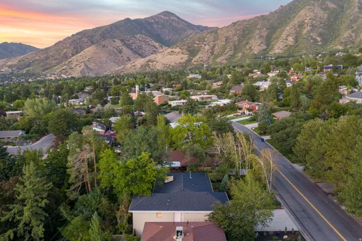 Ariel view of home and mountain backdrop