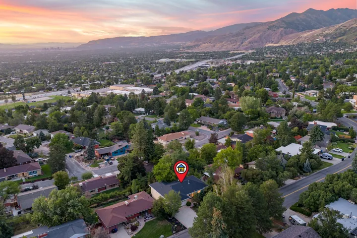 Ariel view of home and Salt Lake City backdrop