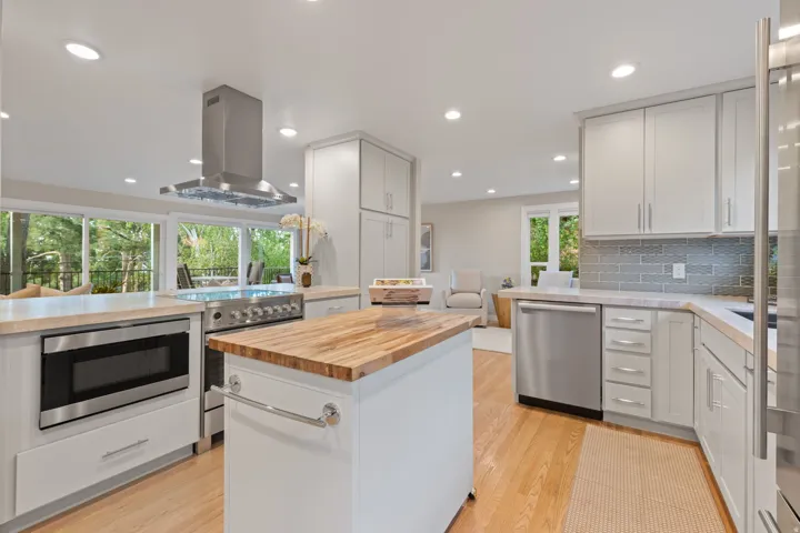 Contemporary kitchen featuring Sub-Zero built-in refrigerator (2018-19 remodel), Miele dishwasher (2025), Fisher + Paykel induction range (2025)