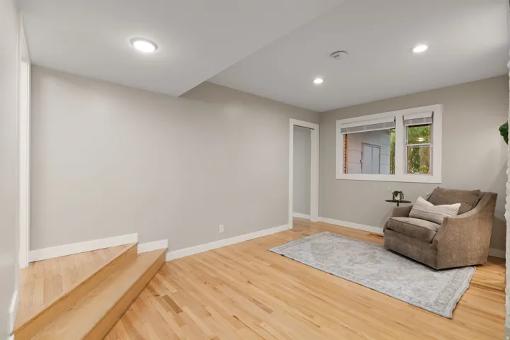Lower level sitting area with access to 2 bedrooms and bathroom