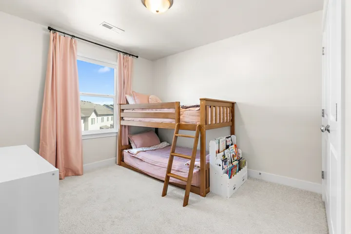 Light-colored wall paint, recessed lighting, double-paned window, and a paneled interior door