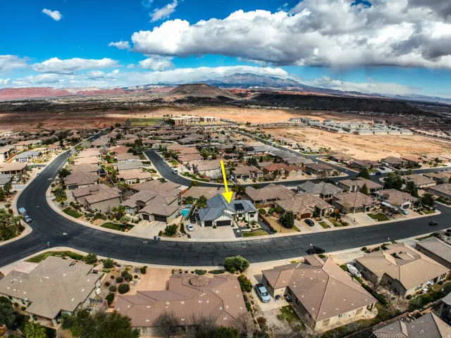 Aerial view - residential property situated on a curved street within a developed neighborhood