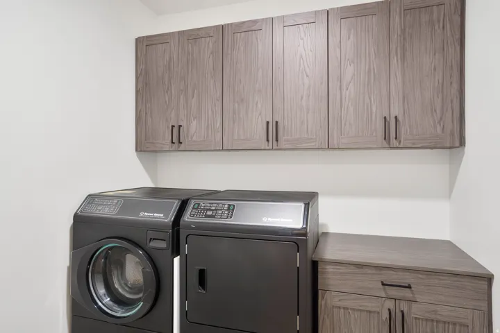 Wood-finish cabinetry with matte black hardware