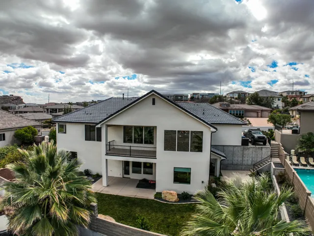 Aerial view - two-story, walk out basement, stucco exterior with a dark tile roof
