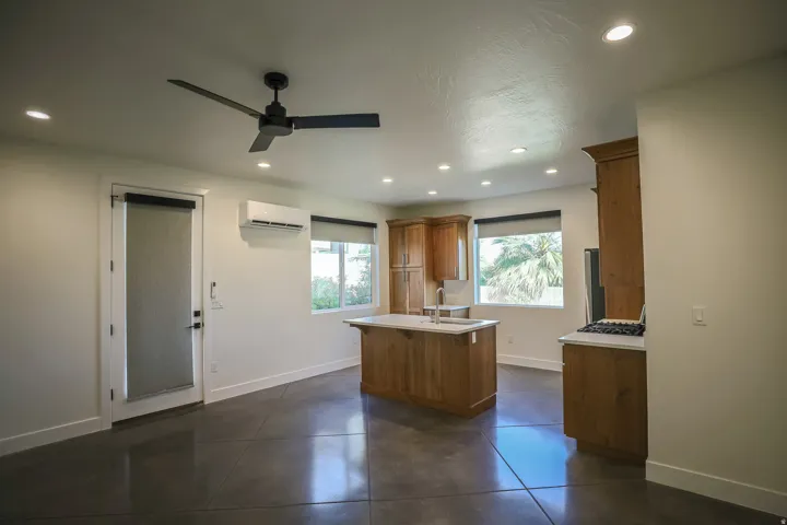 ADU - Recessed lighting and a ceiling fan illuminate the open-concept space