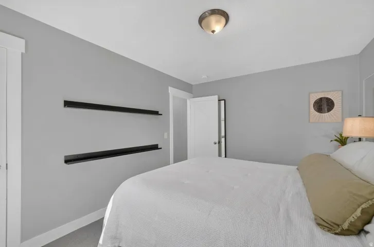 Recessed ceiling light fixture and two wall-mounted display shelves