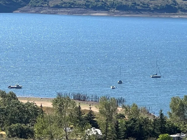 Expansive water expanse with visible shoreline and distant landforms