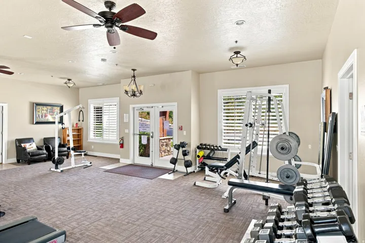 Spacious interior with neutral wall tones and patterned carpet